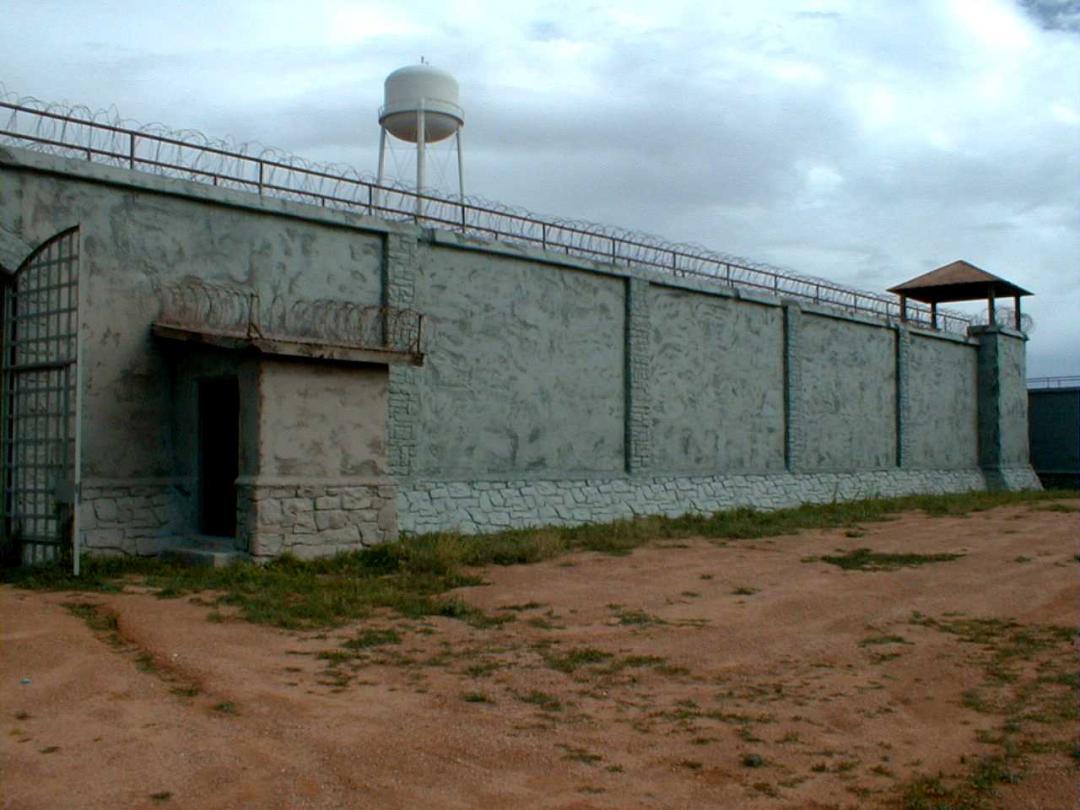 View of the exterior wall surrounding the prison at Old Main