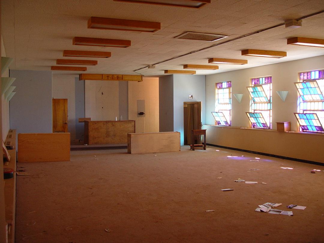 Interior of a room with colored windows at Old Main
